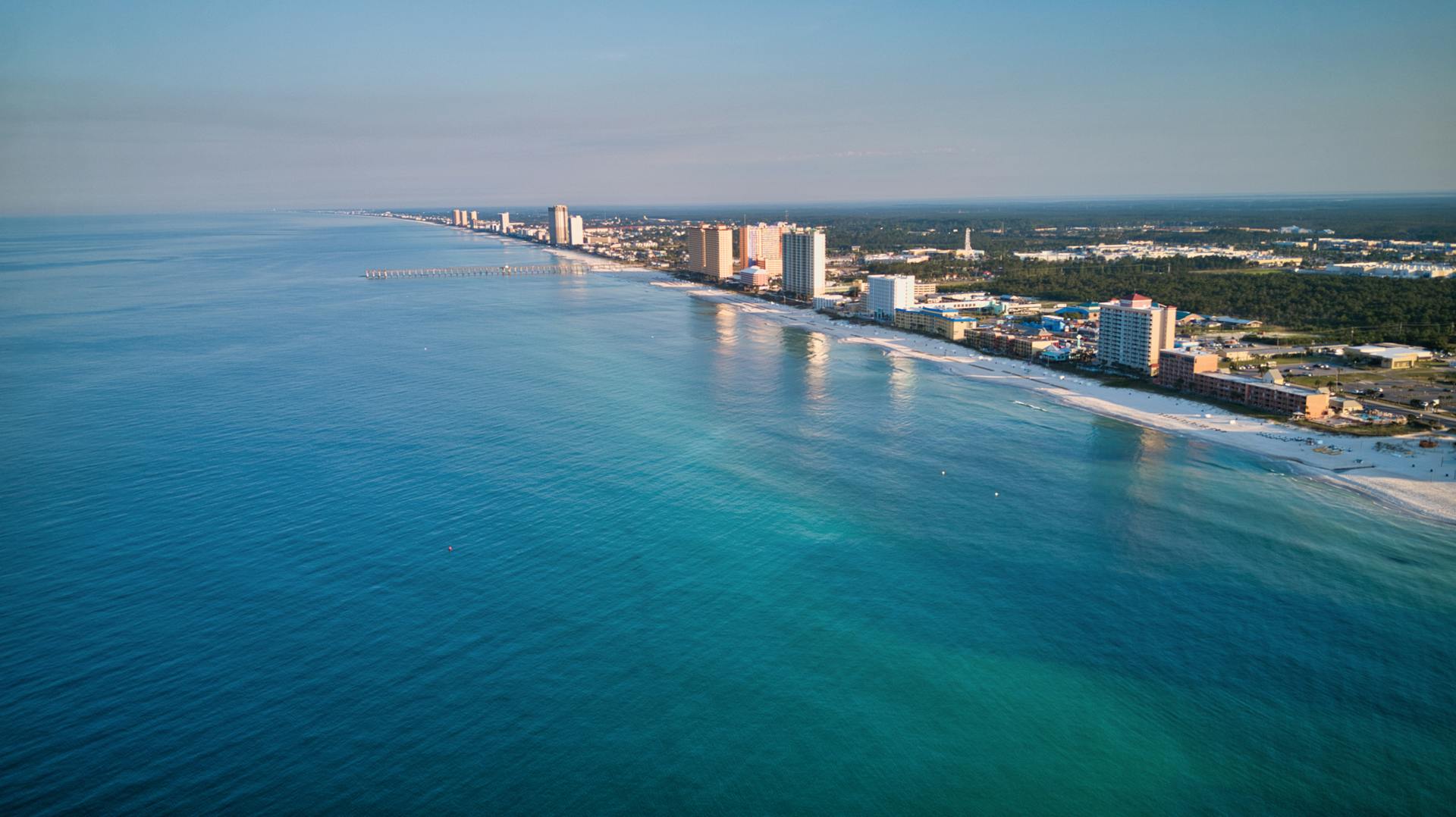Atlantic beach with pier and ocean waves