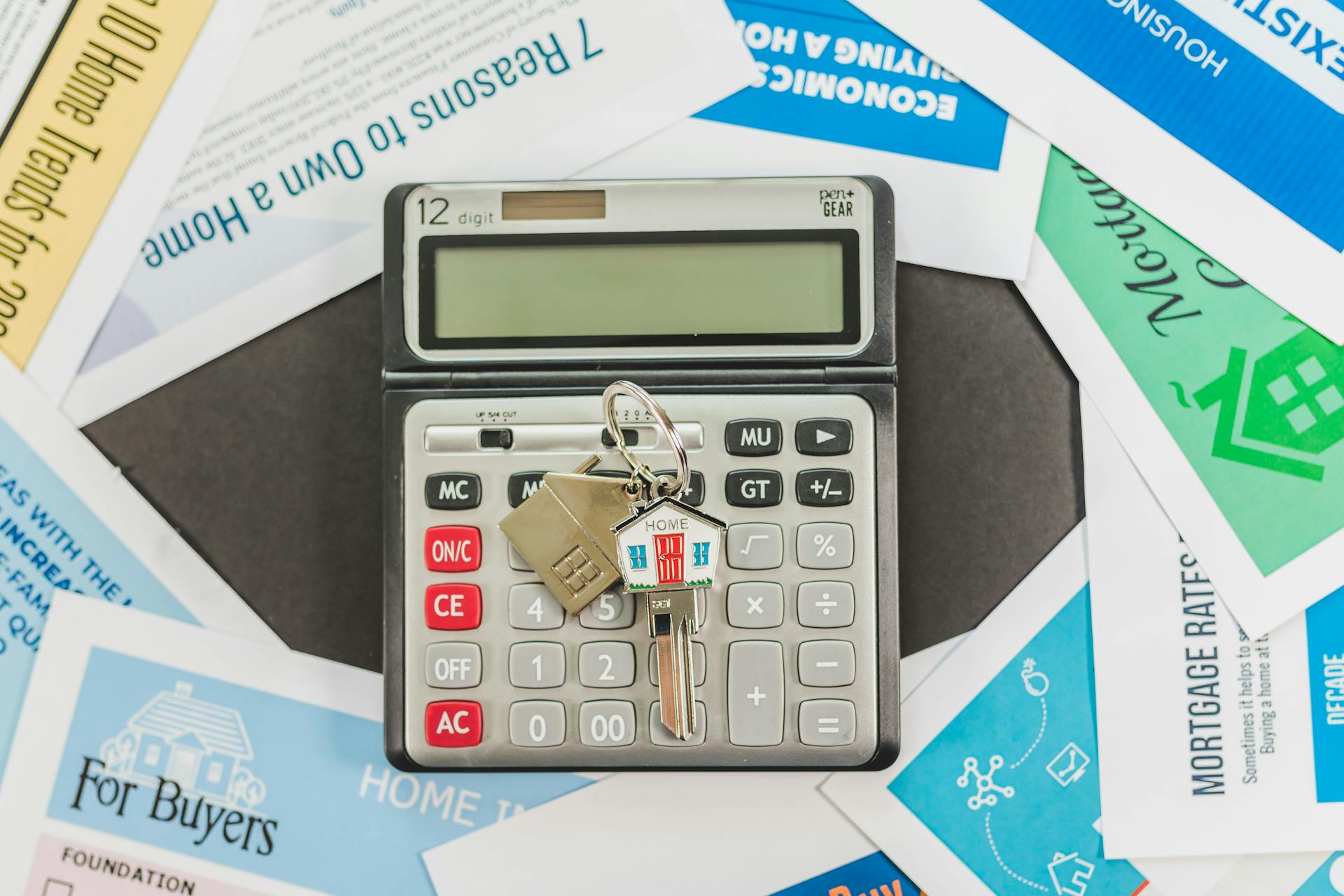 Calculator and financial documents used to review asset depletion mortgage qualification