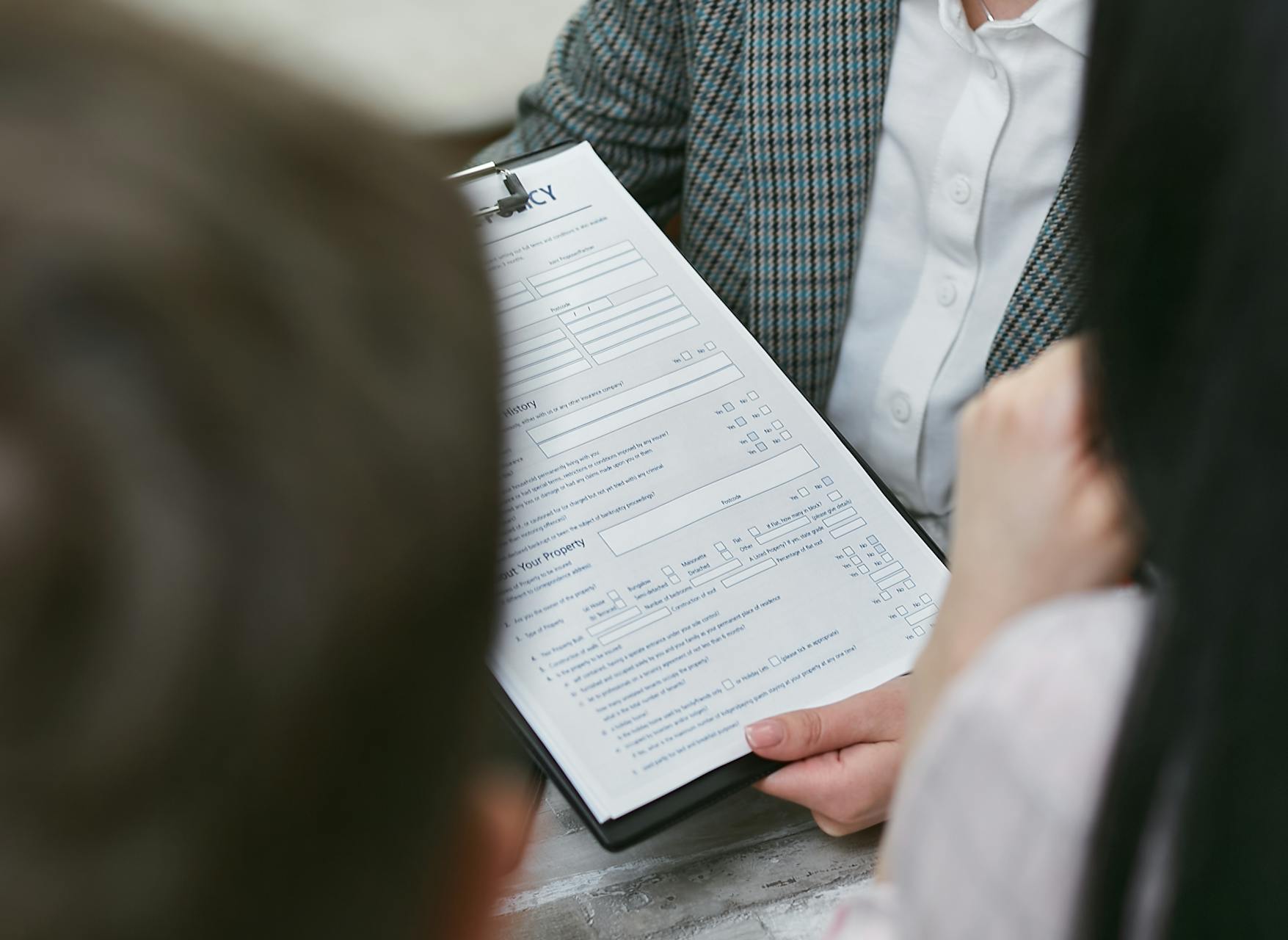 Self-employed borrower reviewing bank statements and financial documents for mortgage qualification